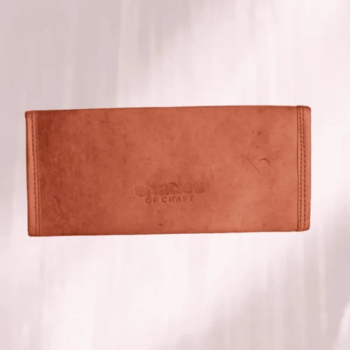 Artisan embossed leather hand clutch