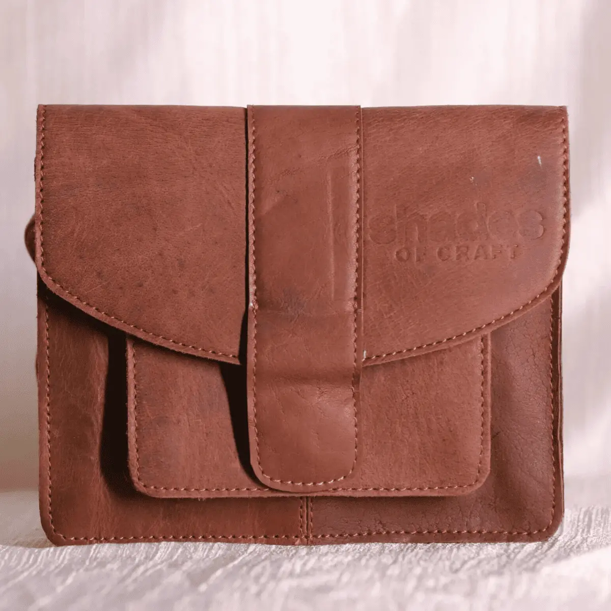 Brown leather sling bag