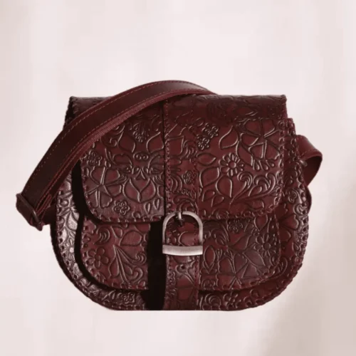 Classic deep reddish-brown hand carved leather sling bag