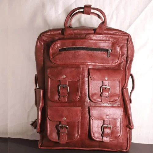https://leather.burnermedia.in/wp-content/uploads/2024/10/Seven-pocket-brick-brown-leather-backpack.webp